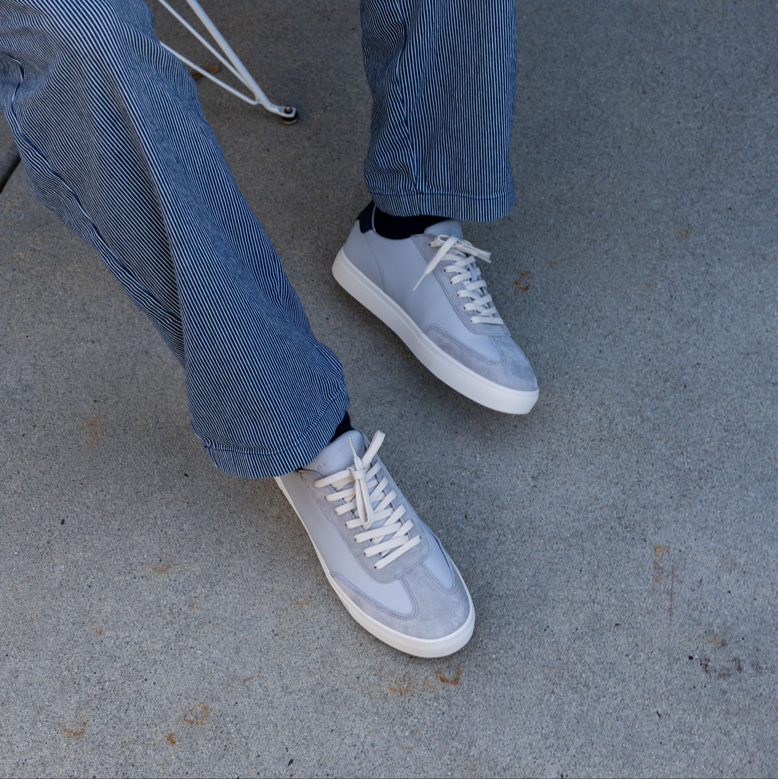 Deane court shoe in Quiet Gray Navy worn in casual lifestyle setting, highlighting comfort, durability, and premium materials.