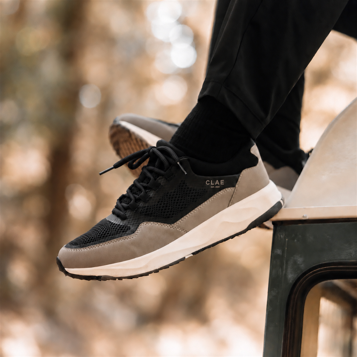 CLAE Milo Black Fallen Rock – Lifestyle view with black round laces