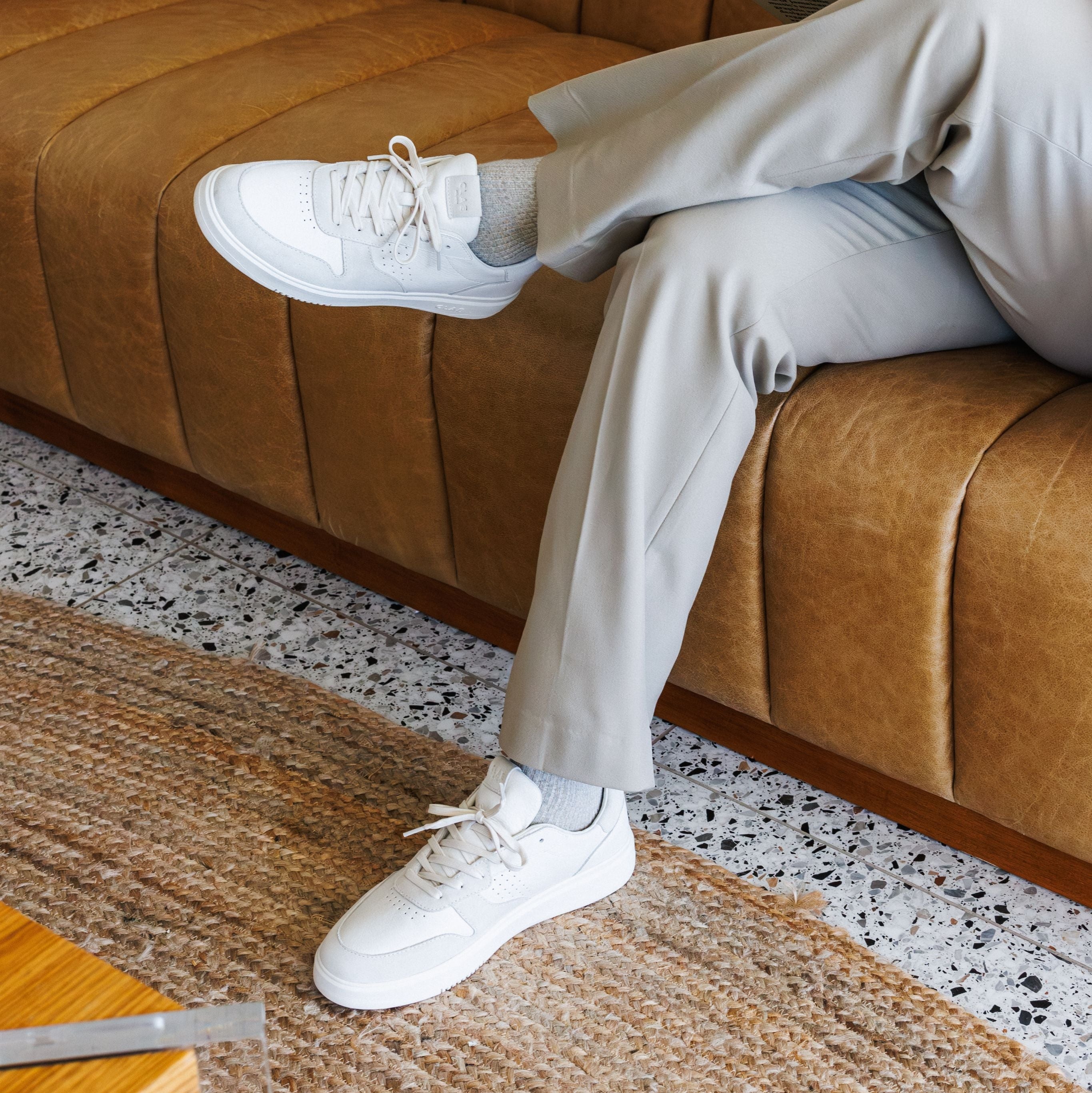 Moses sneaker in Triple Off-White worn in casual lifestyle setting, highlighting comfort, durability, and timeless style.