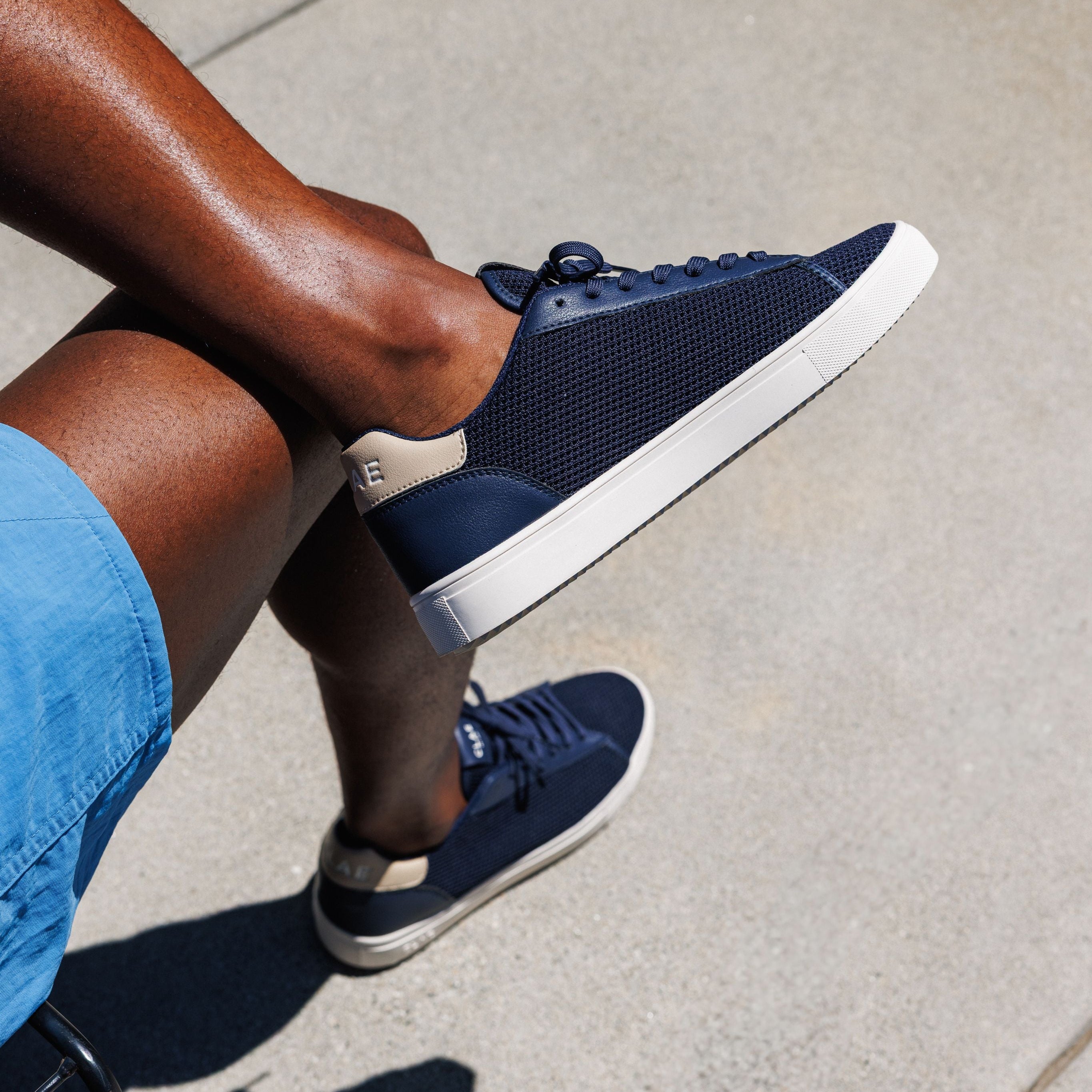 Bradley Knit shoe in Navy Safari worn in casual lifestyle setting, highlighting comfort, breathability, and eco-friendly materials.