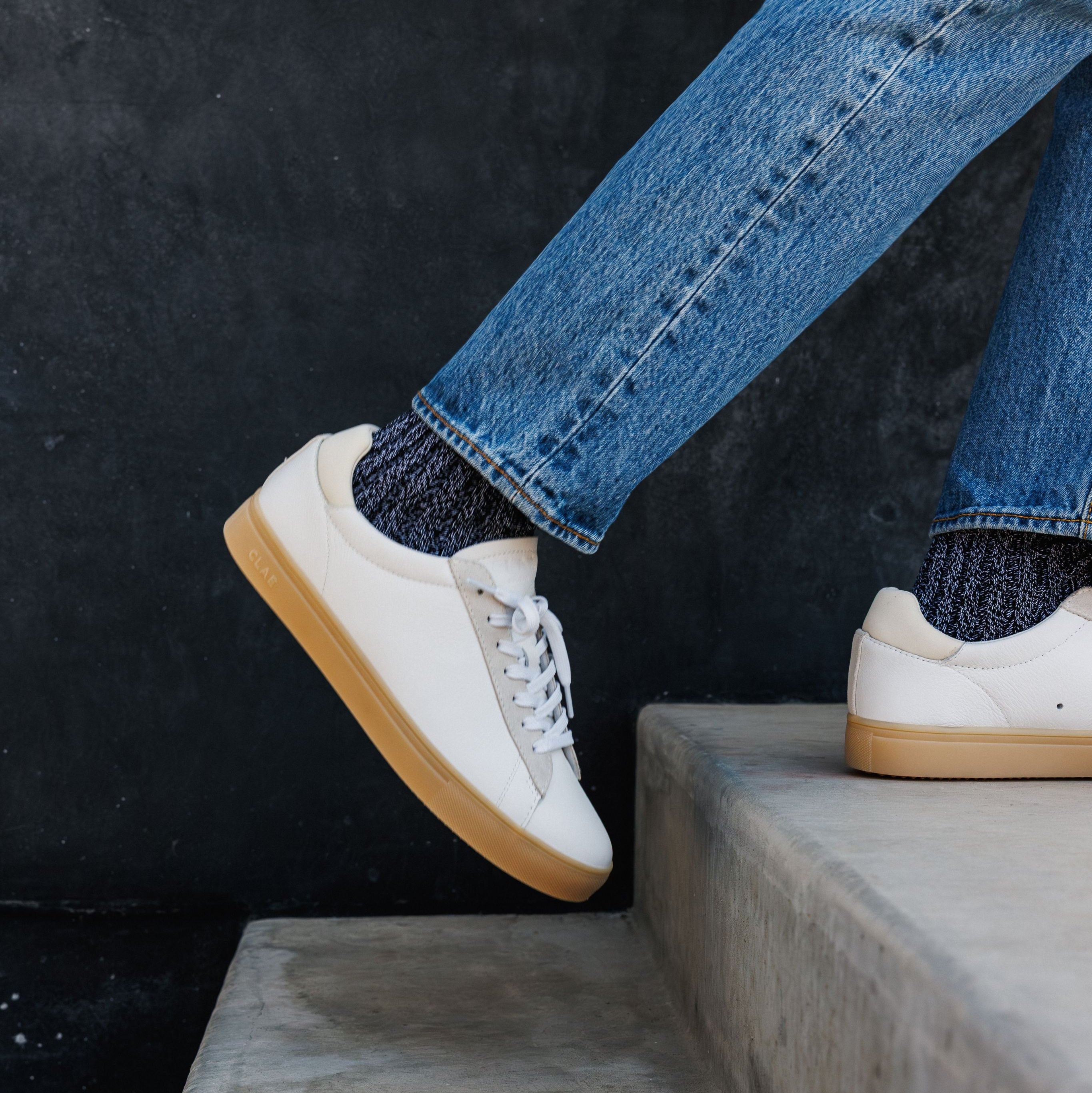 Bradley court shoe in White Off-White Light Nat Gum worn in casual lifestyle setting, highlighting comfort, elegance, and premium materials.