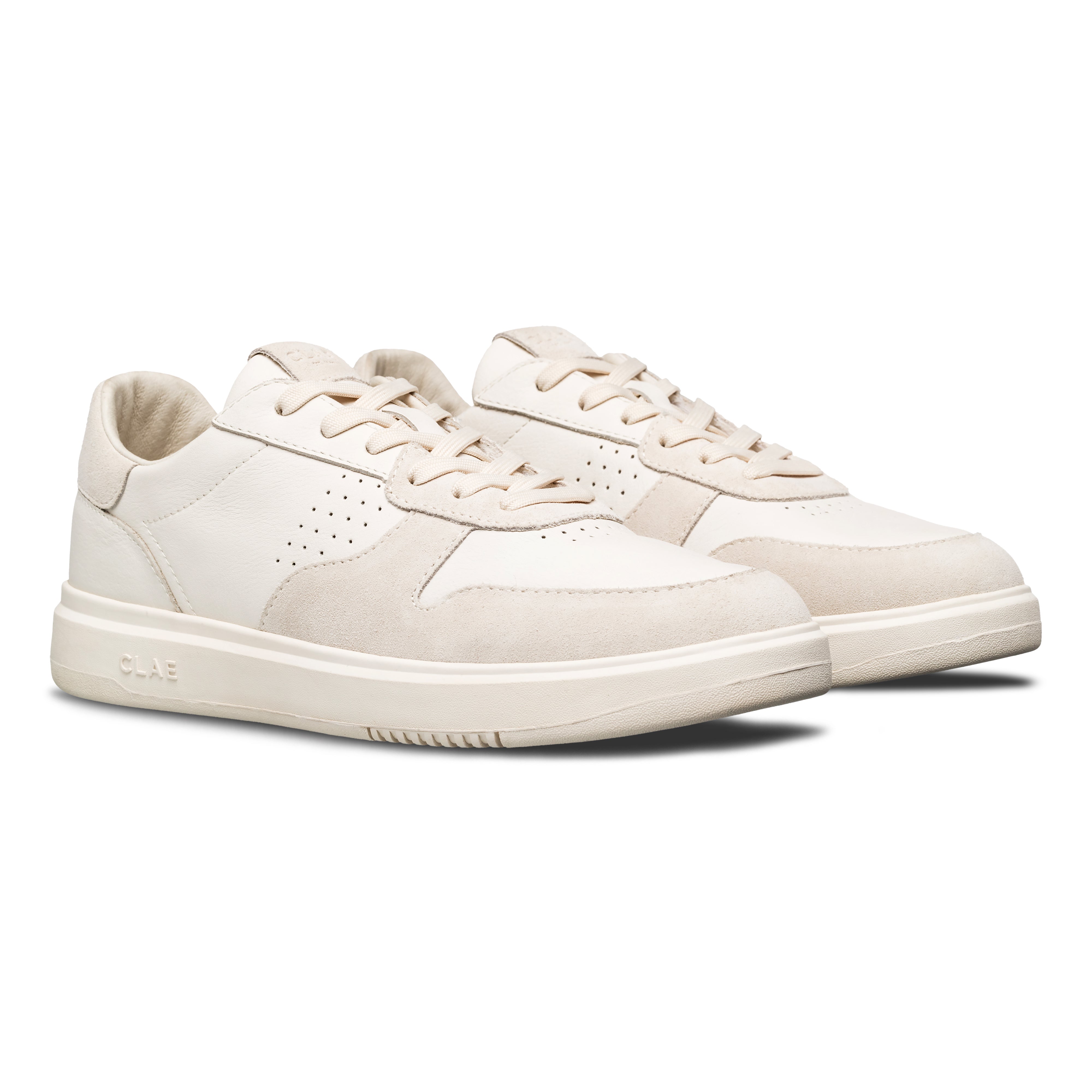 Three-quarter view of Moses sneaker in Triple Off-White, highlighting premium materials and All Court (AC) outsole construction.