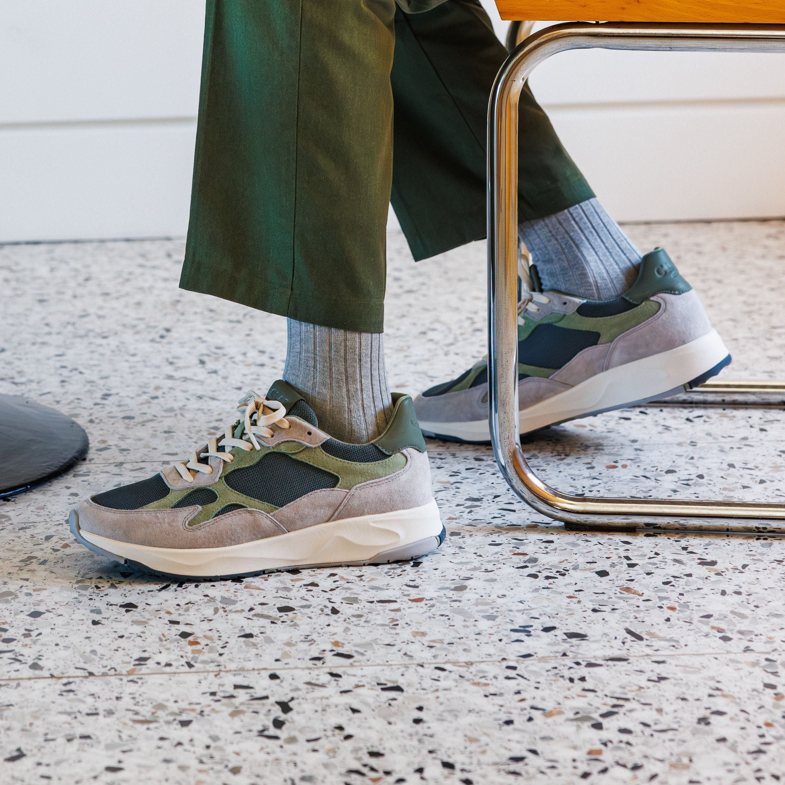 Zuma runner in Quiet Gray Tea worn in casual lifestyle setting, highlighting comfort, flexible construction, and premium design.